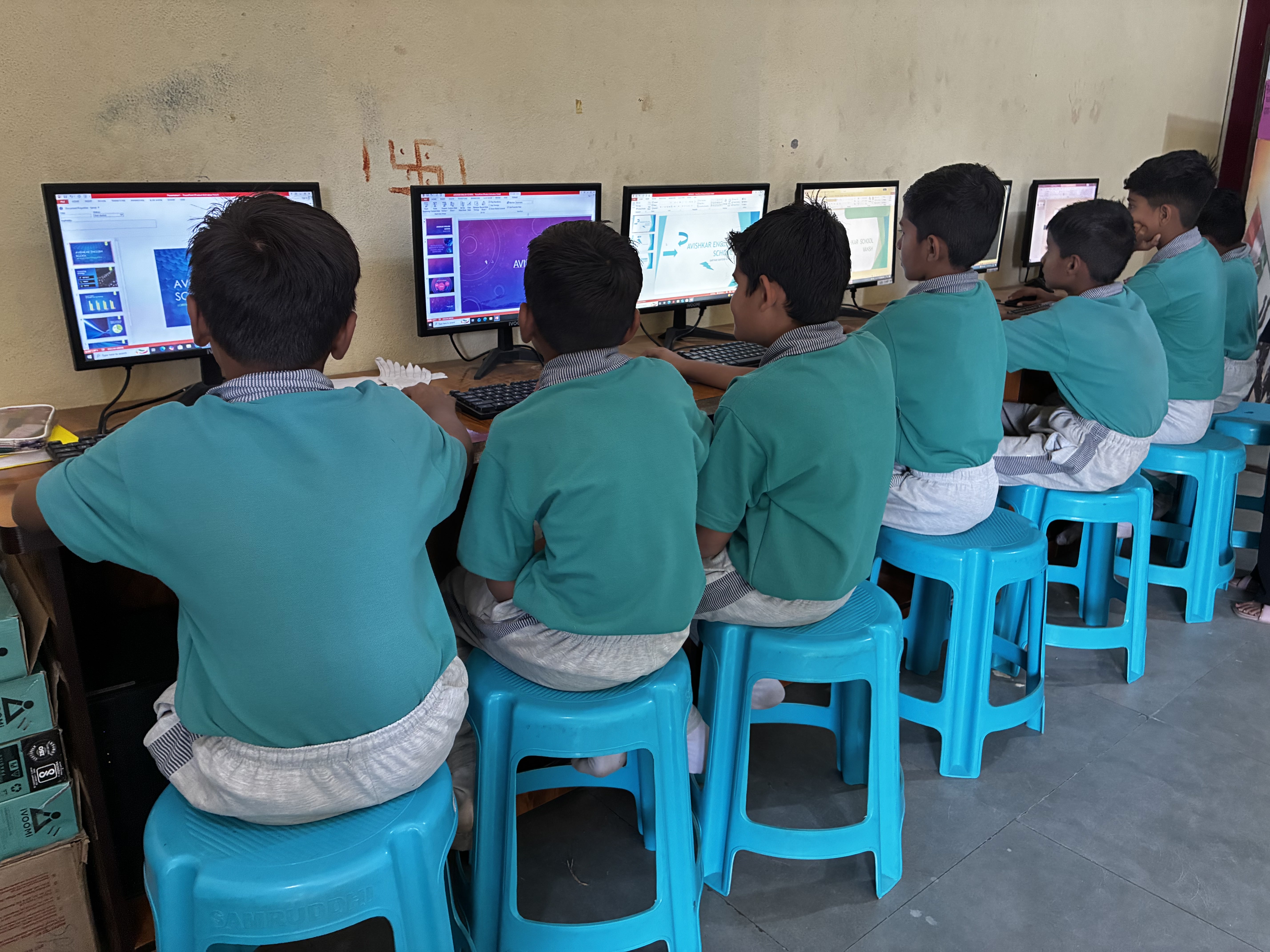 Students learning basics of computing in lab